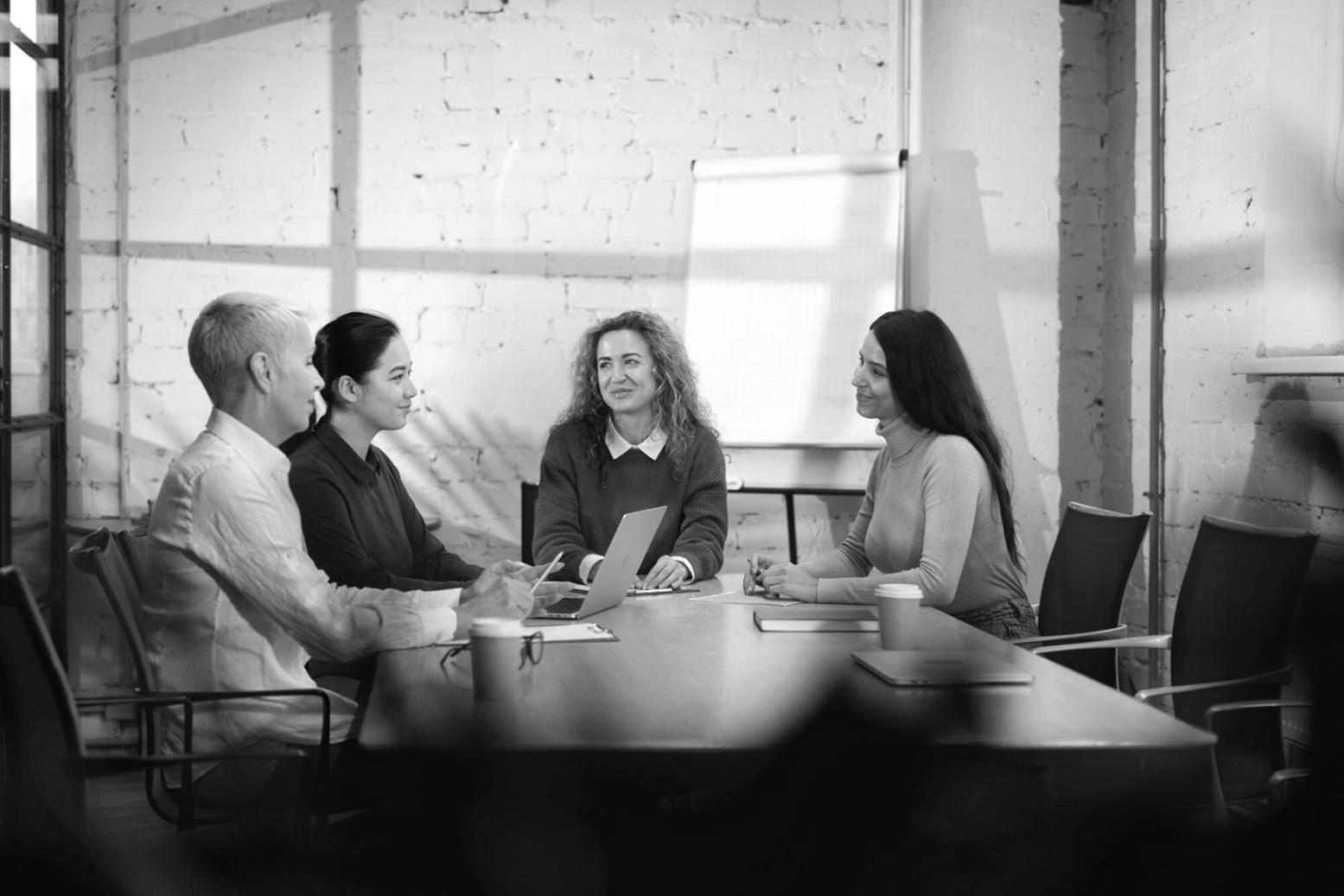 Financial advisor reviewing investment portfolio and planning documents with client